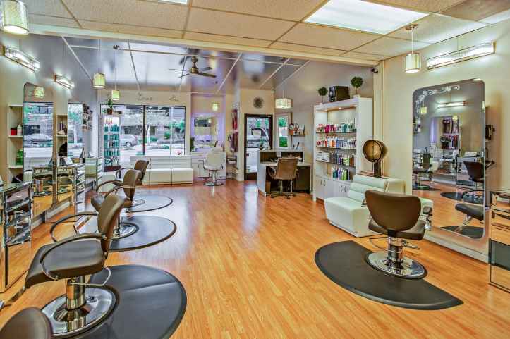 white and brown chairs inside a salon