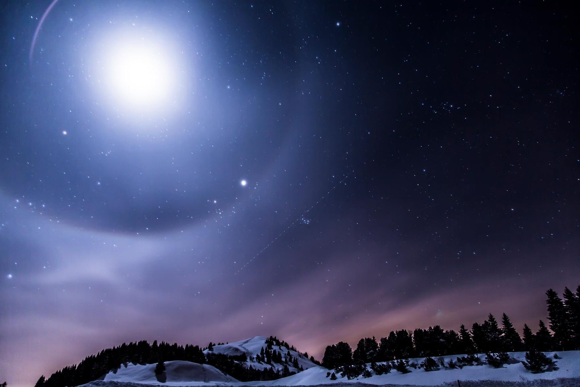 scenic view of mountains against sky at night
